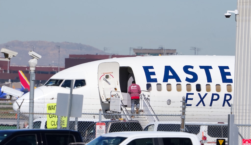(Chris Samuels | The Salt Lake Tribune) A person in shackles boards an Eastern Air Express plane for a U.S. Immigration and Customs Enforcement flight at Salt Lake City International Airport, Monday, April 6, 2026.