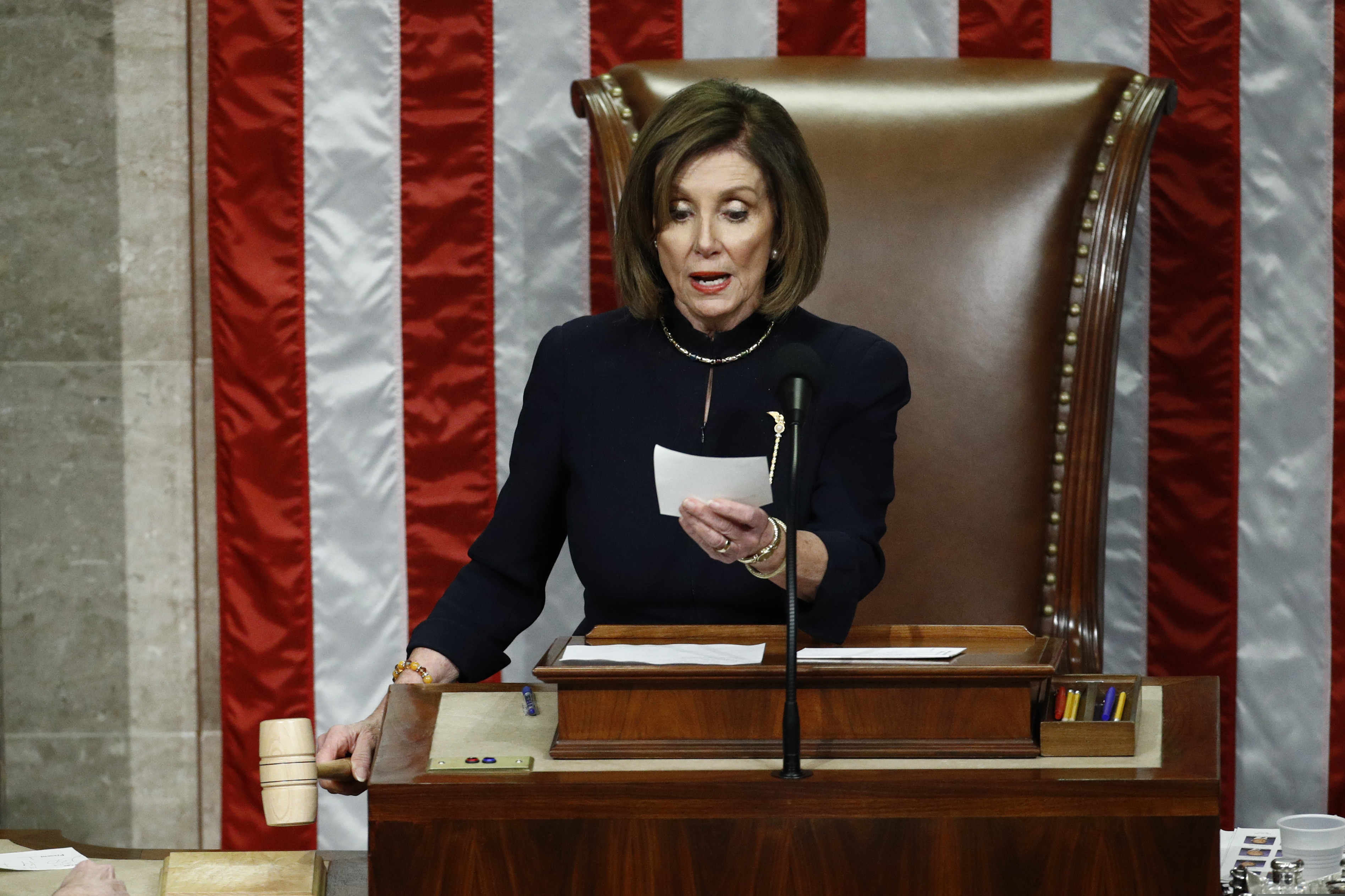 (Patrick Semansky | AP) House Speaker Nancy Pelosi of California readies to strike the gavel as she announces the passage of Article II of impeachment against President Donald Trump, Wednesday, Dec. 18, 2019, on Capitol Hill in Washington.