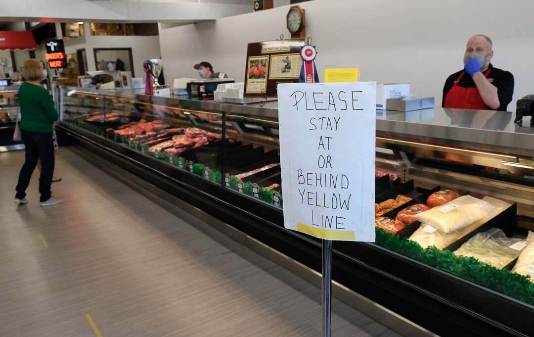 (Francisco Kjolseth  |  The Salt Lake Tribune) A steady stream of customers is allowed in to visits Snider Brothers Meats in Cottonwood Heights as another leaves on Tuesday, May 5, 2020, where owners Will and Amy Wilson, have been trying to keep things as safe as possible through regular sanitizing, social distancing and requiring all customers wear a mask.