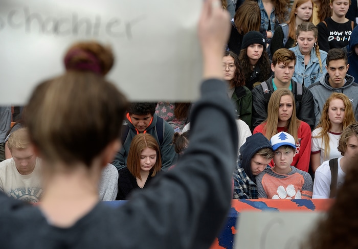 Scott Sommerdorf | The Salt Lake Tribune
Students at Brighton High observe a minute of silence for each sign held up for all of the 17 students and staff killed at Marjory Stoneman Douglas High School, during their walkout at Brighton High School, Wednesday, March 14, 2018.
