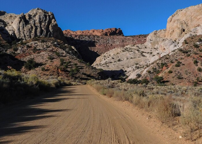 Erin Alberty  |  The Salt Lake TribuneThe Burr Trail faces a should-be impassable wall of rock as it approaches the Waterpocket Fold on Oct. 5, 2015 in Capitol Reef National Park. The lines of the switchbacks can be seen in faint relief on the rust-colored rock.