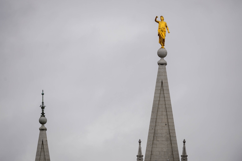 (Trent Nelson  |  The Salt Lake Tribune) The Angel Moroni statue atop the Salt Lake Temple is missing its trumpet after it fell during an earthquake in March 2020.