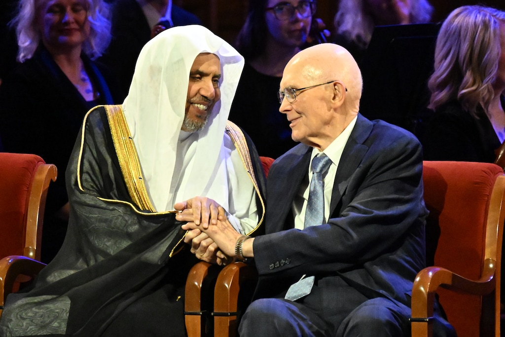 (The Church of Jesus Christ of Latter-day Saints) President Dallin H. Oaks, right, greets Mohammad Abdulkarim Al-Issa, secretary-general of the Muslim World League, during the opening ceremony of the 2026 G20 Interfaith Forum in the Tabernacle in Salt Lake City on Thursday, Oct. 15, 2026.