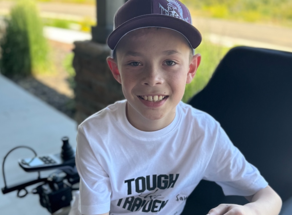 (Tiffany Vendela) Trayden Vendela, 9, sports a "Tough like Trayden" shirt as he recovers from a May crash near his home in Huntsville, where he was struck by a car while riding bikes with his brother.