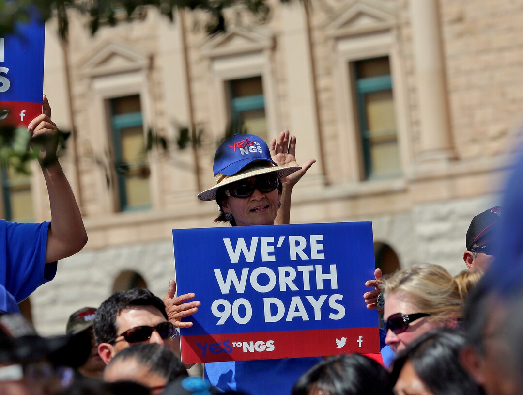 People rally outside the Capitol in Phoenix, Wednesday, June 6, 2018. Hundreds of Navajo Generating Station employees, relatives and union and tribal leaders rallied at the state Capitol in Phoenix on Wednesday to request a 90-day pause in steps to close the coal-fueled plant by the end of 2019 as scheduled. (AP Photo/Matt York)