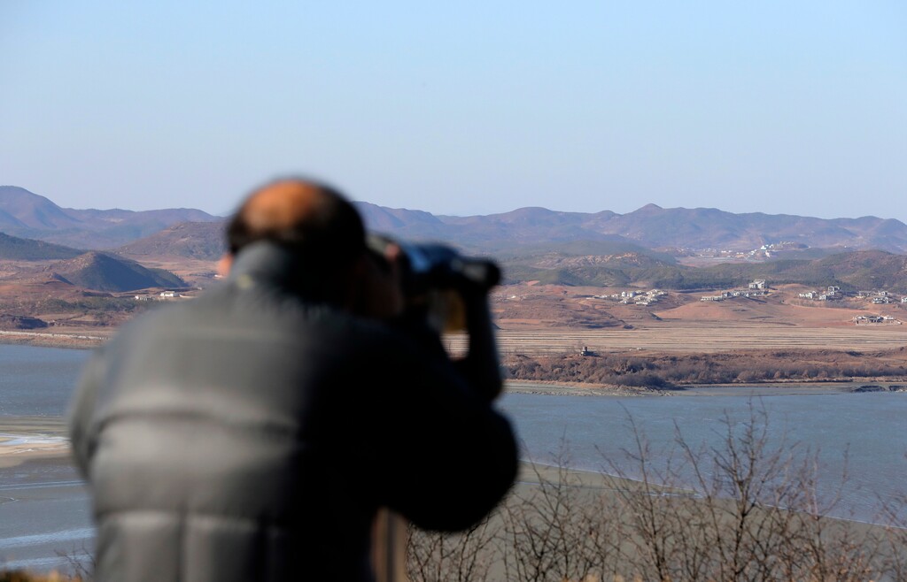 A visitor uses binoculars to see the North Korea side from the unification observatory in Paju, South Korea, Thursday, Nov. 30, 2017. The U.S. ambassador to the United Nations said Wednesday that North Korea's launch of an intercontinental ballistic missile — which some observers believe could reach the Eastern U.S. — "brings us closer" to a war the U.S. isn't seeking. (AP Photo/Lee Jin-man)
