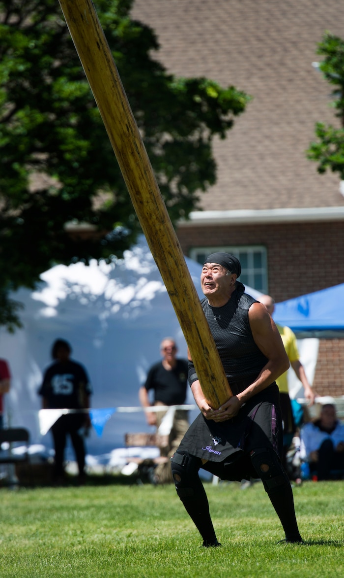 (Rick Egan  |  The Salt Lake Tribune)      Kengo Kubota, Fukushima competes in the Caber Toss, at the 44th annual Utah Scottish Festival and Highland Games at the Utah State Fairgrounds, Sunday, June 10, 2018.