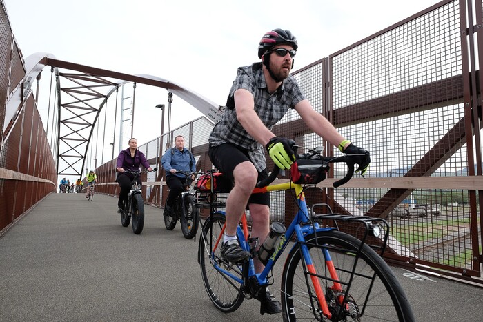 (Francisco Kjolseth | The Salt Lake Tribune) People join Salt Lake City Mayor Jackie Biskupski on Thursday, May 16, 2019, as part of the annual MayorÕs Bike to Work Day. This yearÕs ride began at the Northwest Recreation Center and ran primarily along the Jordan River Trail in an effort to show off the investments the city and others have made to the trail including the new 120-foot arch bridge that connects the north and south sides of the trail between 200 South and North Temple.