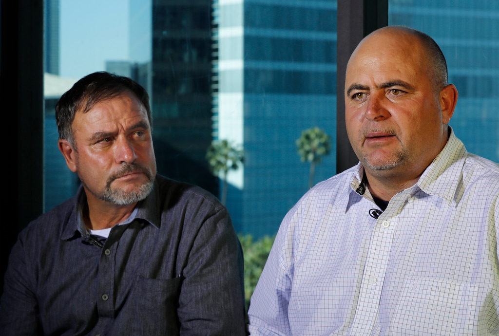 Adrian LeBaron, left, looks over at Julian LeBaron during an interview in Mexico City, Tuesday, Dec. 3, 2019. LeBaron and other relatives of nine U.S. dual citizens slaughtered in northern Mexico last month say President Andres Manuel Lopez Obrador prayed with them for the safety of the country and pledged to visit the region. Three young mothers and six children were killed in the attack near the border of the northern states of Sonora and Chihuahua. Officials have said a drug cartel is suspected in the attack. (AP Photo/Marco Ugarte)