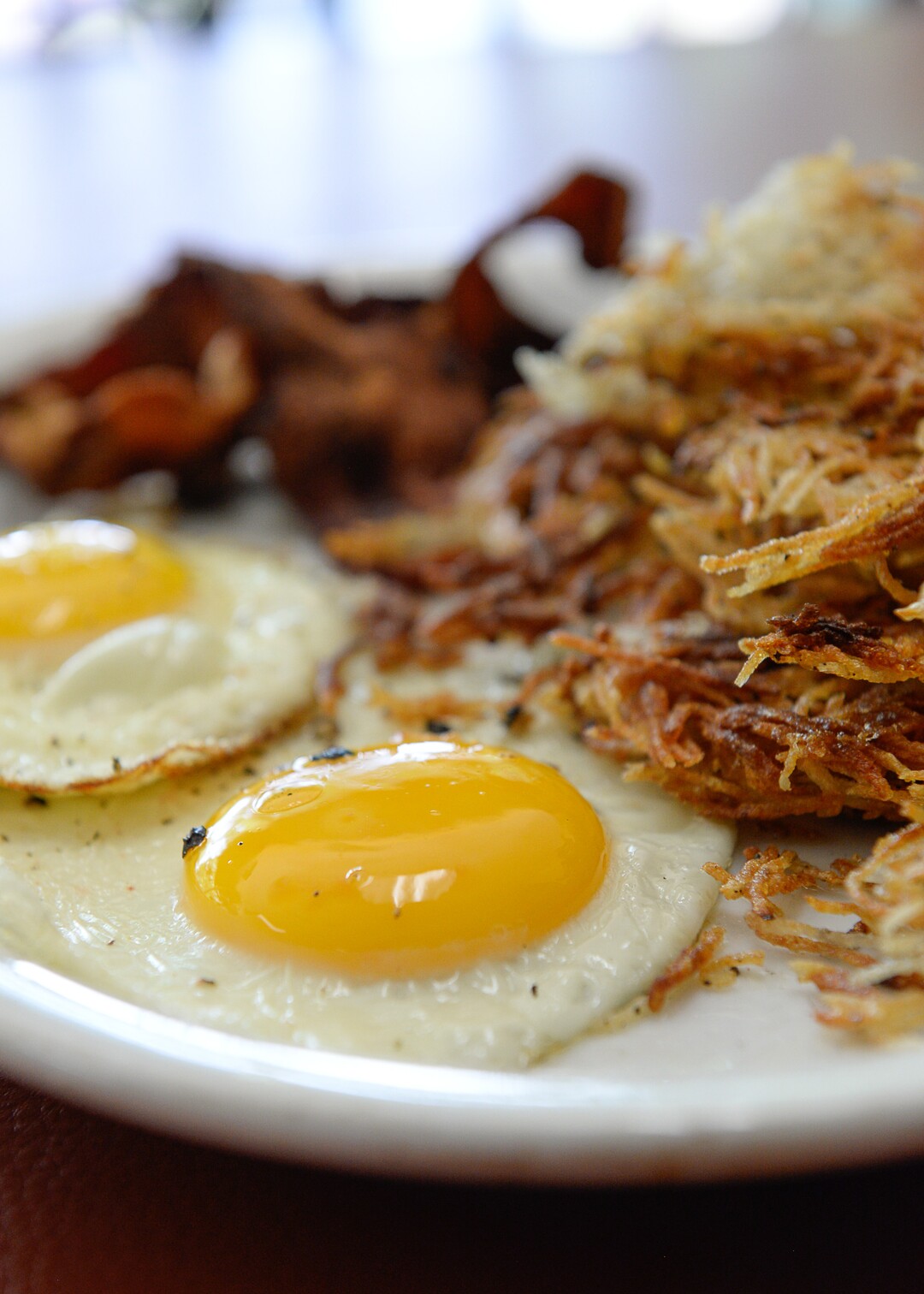 (Francisco Kjolseth  |  The Salt Lake Tribune) The Twin Suns breakfast includes two eggs — sunny side up — hashbrowns, choice of breakfast meat and fresh fruit on the side.