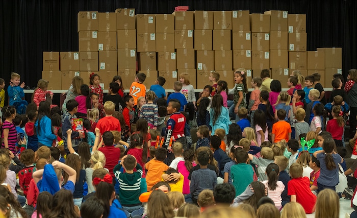 (Rick Egan  |  The Salt Lake Tribune)  Students react as Ms. Worthington the principal of Oquirrh Elementary opens the curtain during an assembly to show the students how many boxes of cereal that were donated to her for surprise gifts for all 650 students at her school, in West Jordan, Thursday, Dec. 20, 2018.


