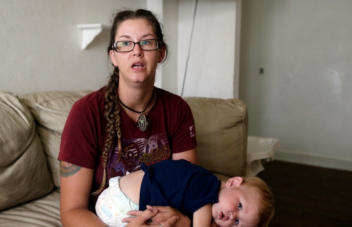 (Jason Dearen | AP Photo) This Sept. 22, 2017 photo shows Shelby Hoogendyk and her 17 month-old son Caelan, at the St. Francis House in St. Augustine, Fla. Hoogendyk, her son and husband were evacuated from the homeless shelter during Hurricane Irma. When they arrived at a hurricane shelter they were segregated from the rest of the evacuees. Advocated for the homeless say the ill treatment of homeless people during disasters is a national problem that reflects the lack of state and local emergency planning to deal with that population.