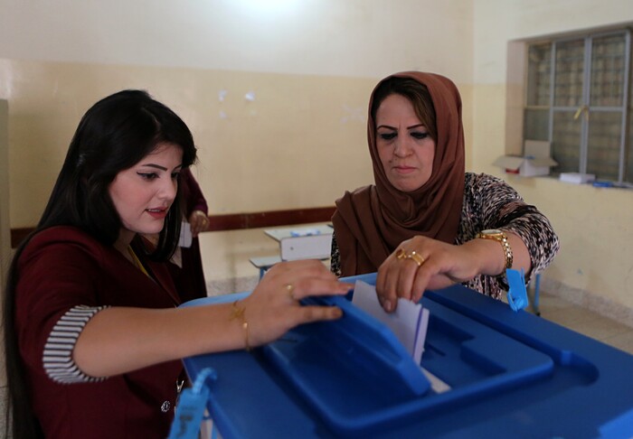 An Iraqi Kurdish woman casts her ballot during the referendum on independence from Iraq in Irbil, Iraq, Monday, Sept. 25, 2017. (AP Photo/Khalid Mohammed)