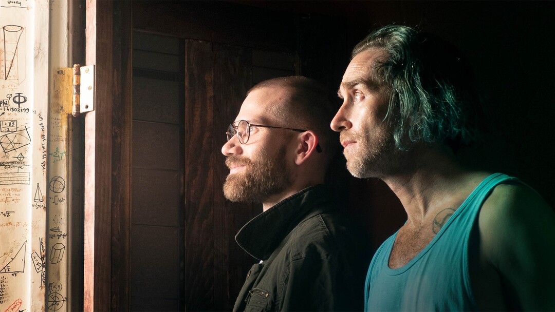 (Aaron Moorhead  |  Sundance Institute) Aaron Moorhead and Justin Benson play neighbors who chronicle strange doings around their apartment building in "Something in the Dirt," which they wrote and directed. The film is an official selection of the Next section at the 2022 Sundance Film Festival.