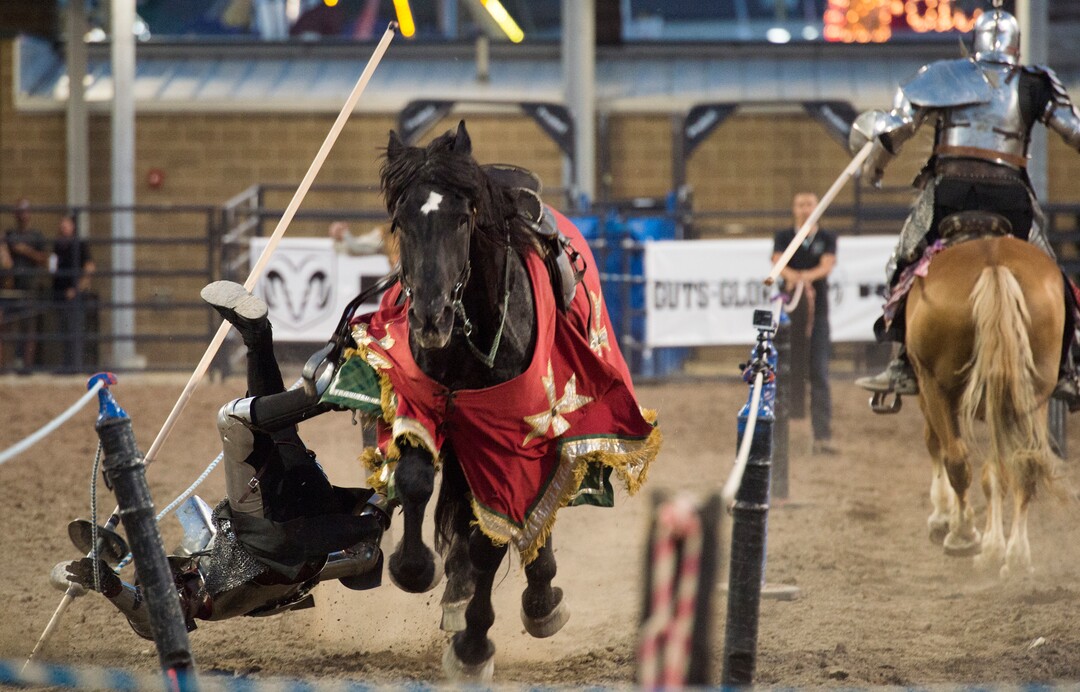 (Rick Egan  |  The Salt Lake Tribune)     Cody Bailey is knocked off his horse by Charlie Andrews, in the Knights of Mayhem jousting competition, at the Utah State Fair, Thursday, Sept. 6, 2018.