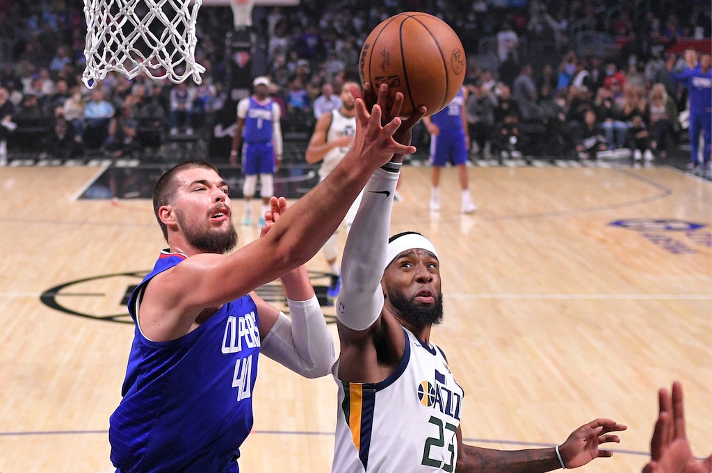 (Mark J. Terrill | AP) Los Angeles Clippers center Ivica Zubac, left, and Utah Jazz forward Royce O'Neale grafter a rebound during the first half of an NBA basketball game Tuesday, March 29, 2022, in Los Angeles.