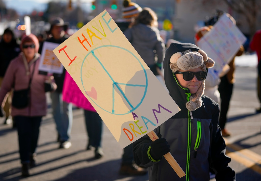 (Bethany Baker  |  The Salt Lake Tribune) Demonstrators march along 1300 East during the Martin Luther King Jr. rally and march in Salt Lake City on Monday, Jan. 15, 2024.