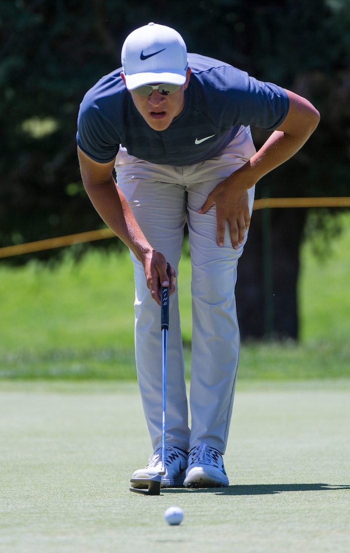 (Rick Egan  |  The Salt Lake Tribune)     Cameron Champ from Sacrament, CA, checks the line of his putt, during the Utah Championship golf event on the Web.com Tour at Oakridge Country Club in Farmington. Champ finished 17-under par to lead the field for the second day in a row. July 13, 2018.

