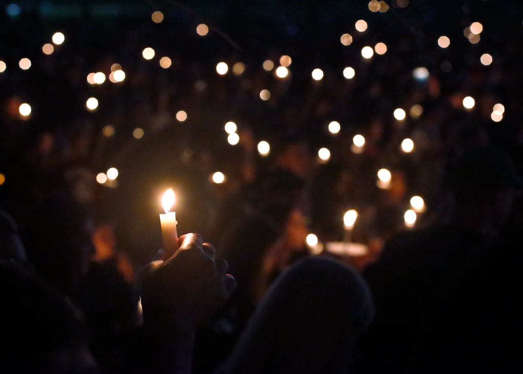 (Wilfredo Lee | AP file photo)  In this Thursday, Feb. 15, 2018, file photo, attendees hold up their candles at a candlelight vigil for the victims of the shooting at Marjory Stoneman Douglas High School, in Parkland, Fla.