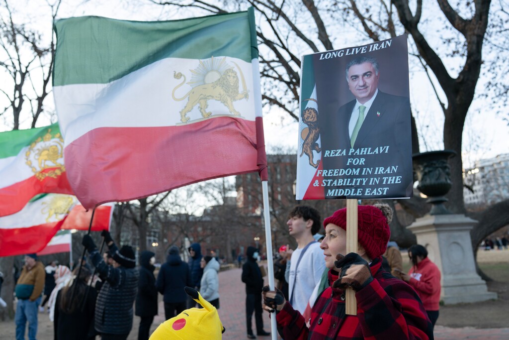 Activists take part in a rally supporting protesters in Iran at Lafayette Park, across from the White House in Washington, Sunday, Jan. 11, 2026. (AP Photo/Jose Luis Magana)