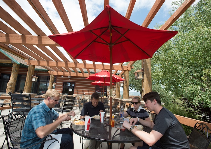 (Rick Egan  |  The Salt Lake Tribune)  Diners eat on the patio at the Silver Summit Cafe, on Silver Creek Drive in Park City, Wednesday, Aug. 16, 2017.