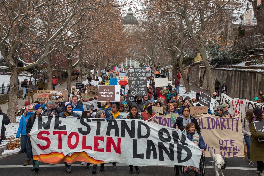 Protesters march from the Utah State Capitol through downtown Salt Lake City during President Donald Trump's visit Monday, Dec. 4, 2017. Roughly 3,000 demonstrators lined up near the State Capitol to protest Trump's announcement of scaling back two sprawling national monuments, and his declaring that "public lands will once again be for public use." (Benjamin Zack/Standard-Examiner via AP)