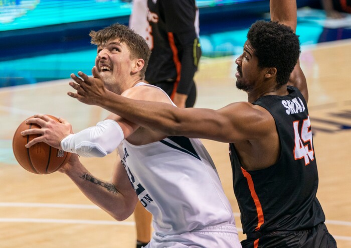 (Rick Egan | The Salt Lake Tribune) Brigham Young Cougars center Richard Harward (42) looks for a shot, as Pacific Tigers forward Nigel Shadd (45) defends, in basketball action at the Marriott Center in Provo, on Saturday, Jan. 30, 2021.