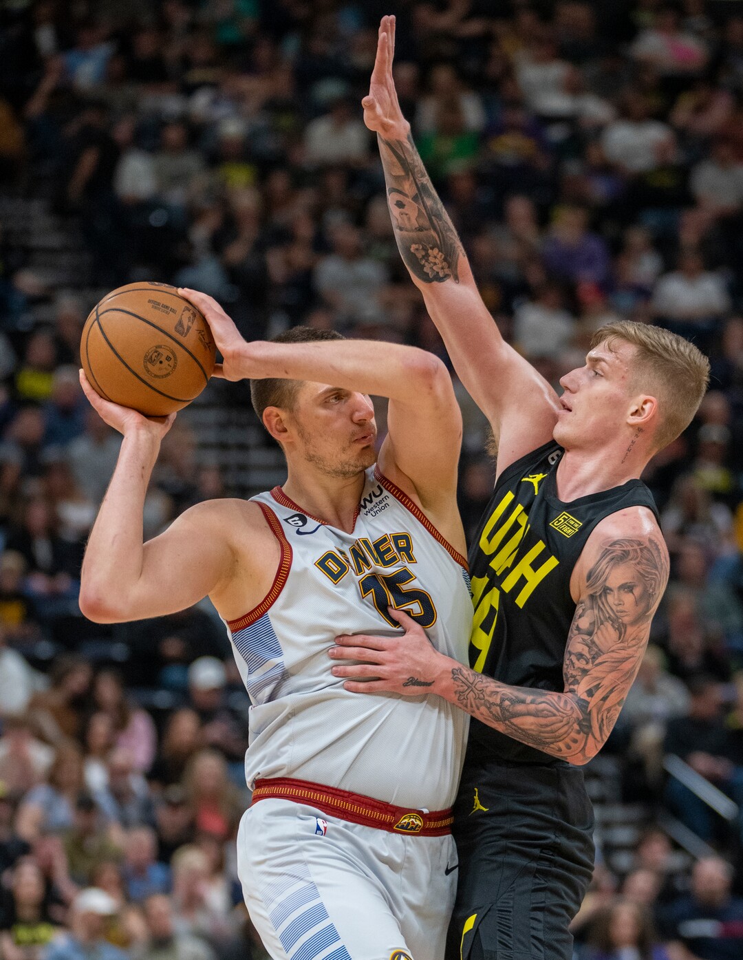 (Rick Egan | The Salt Lake Tribune) in Luka Samanic guards Denver Nuggets center Nikola Jokic (15), in NBA action between the Utah Jazz and the Denver Nuggets at Vivint Arena,  Saturday, April 8, 2023.