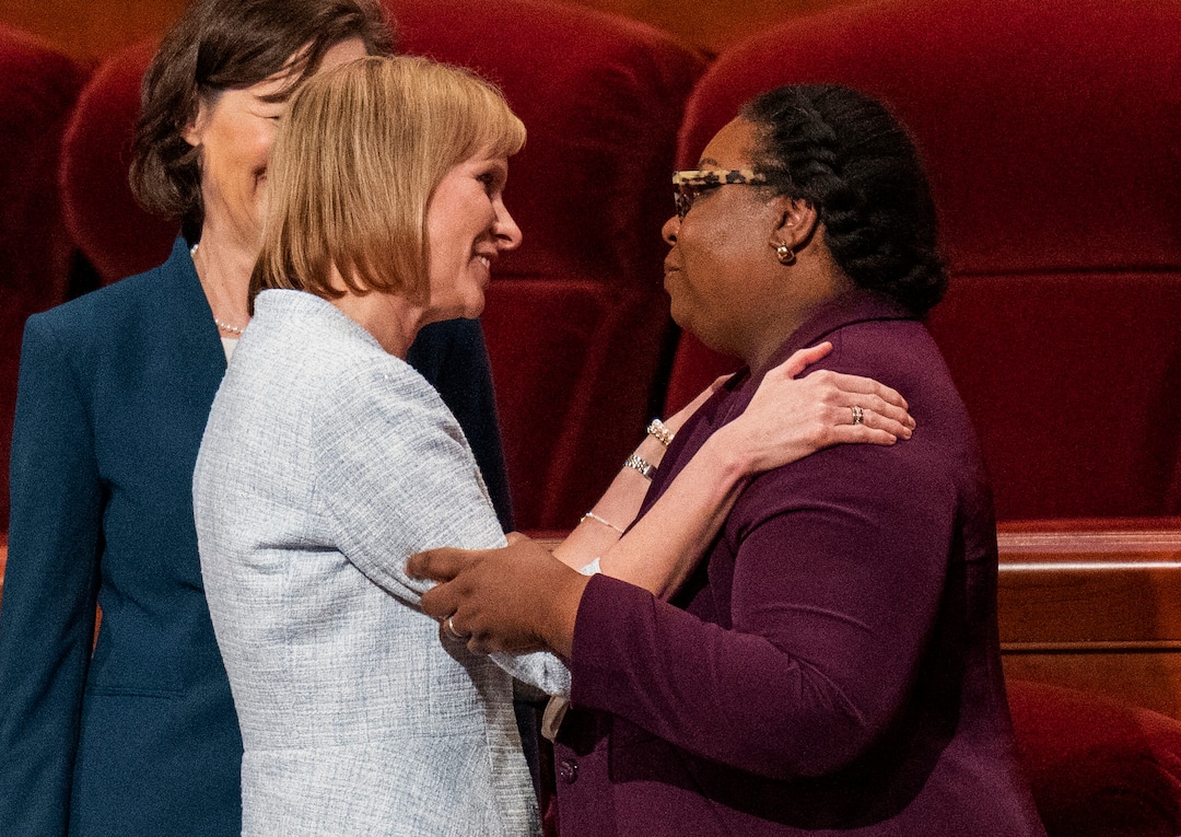 (Rick Egan | The Salt Lake Tribune)  Newly called Primary General Presidency First Counselor Amy Wright hugs Second Counselor Tracy Y. Browning after the afternoon session of LDS General Conference on Saturday, April 2, 2022.
