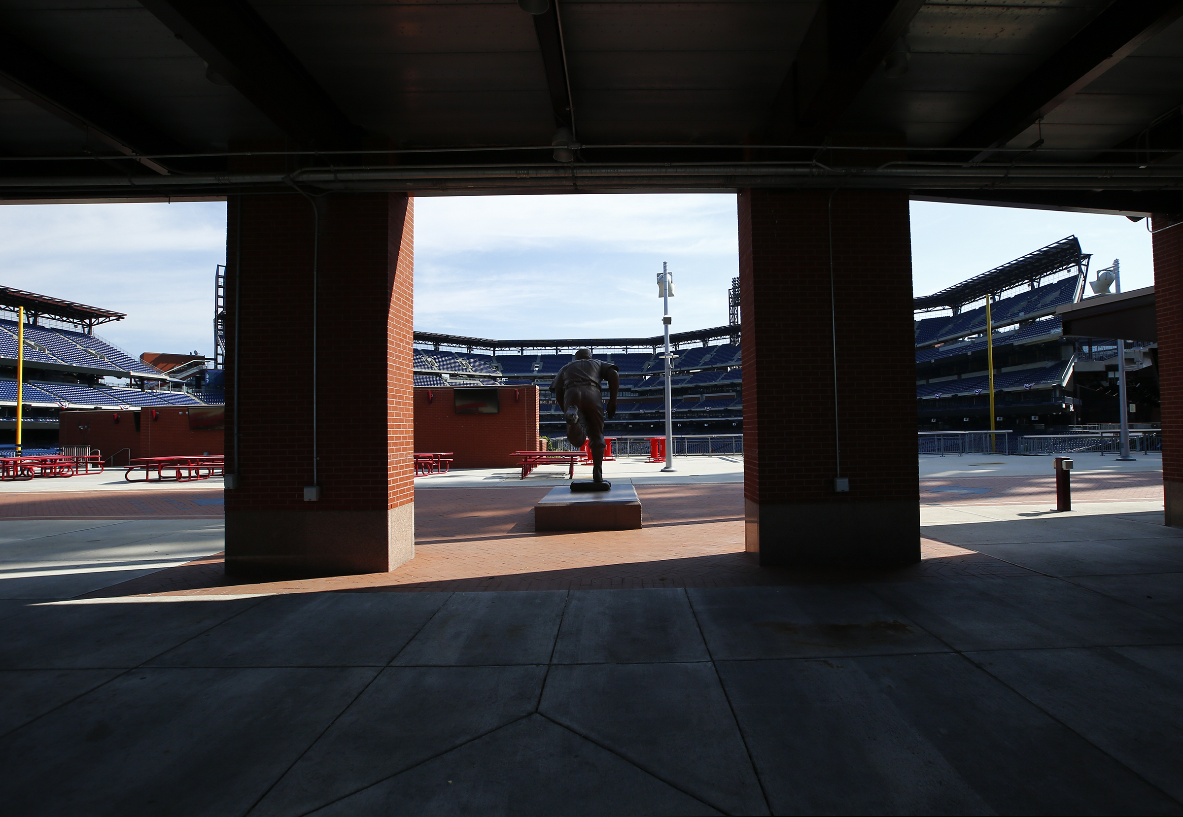 (Yong Kim | The Philadelphia Inquirer via AP) An empty Ashburn Alley faces seats at Citizens Bank Park on Monday, July 27, 2020, in Philadelphia. The Philadelphia Phillies' games against the New York Yankees on Monday and Tuesday was postponed after several members of the Miami Marlins tested positive for the coronavirus.