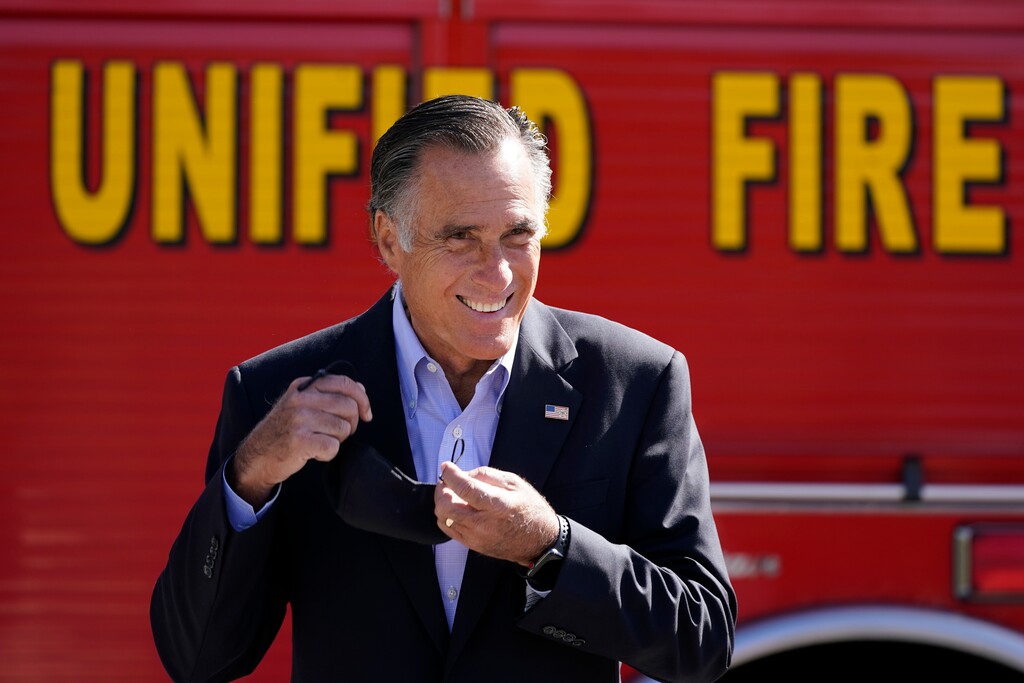 (Rick Bowmer | AP photo)
Sen. Mitt Romney, R-Utah, looks on during a news conference Thursday near Neffs Canyon, in Salt Lake City. Romney announced legislation to establish a national wildfire commission that would make policy recommendations aimed at diminishing future wildfire disasters.