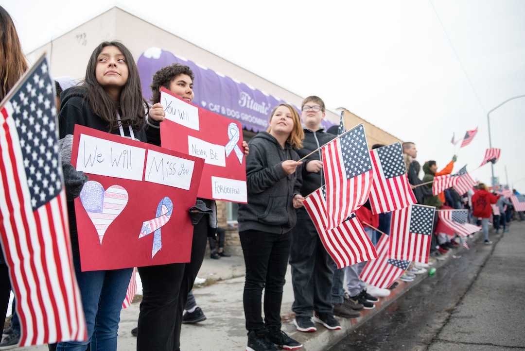 (Keith Johnson  |  special to The Salt Lake Tribune) Students and staff from Granite Park Jr. High line State Street near 3000 South to watch the funeral procession for Officer David Romrell Dec. 5, 2018 in South Salt Lake, Utah. Officer Romrell, a South Salt Lake police officer, was killed in the line of duty Nov. 24th when he was struck by a car driven by a fleeing suspect. 