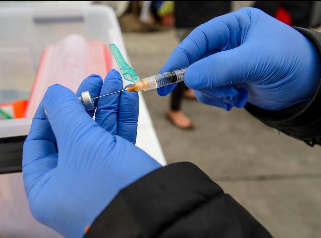 (Steve Griffin  |  The Salt Lake Tribune) Steven Beach, a registered nurse with the Salt Lake County Health Department, prepares a Hepatitis A vaccination dose at a mobile vaccination clinic setup outside at 500 west and 200 south in Salt Lake City Thursday November 16, 2017. The department is setting up the clinics to address the county's outbreak of Hepatitis A . There have been 66 cases here so far this year, mostly in homeless community.