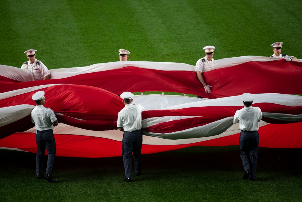(Karsten Moran | The New York Times)
A flag ceremony before Game 3 of the American League Division Series between the New York Yankees and Boston Red Sox at Yankee Stadium in New York, Oct. 8, 2018. "In other ways, our failure in Afghanistan more closely resembles Roman failures that took place far from Rome itself — the defeats that Roman generals suffered in the Mesopotamian deserts or the German forests, when the empire's reach outstripped its grasp," writes The New York Times opinion columnist Ross Douthat.