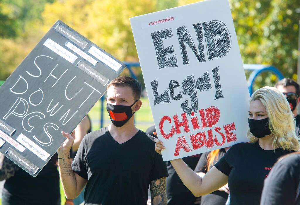 (Rick Egan  |  The Salt Lake Tribune) Johnny O'Neil and Gia Laws listen to speakers during a rally calling for the closure of Provo Canyon School, a residential treatment center in Utah she attended when she was a teen, on Friday, Oct. 9, 2020.