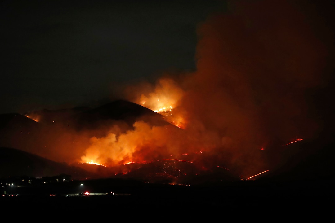 (George Frey  |  for The Salt Lake Tribune) A wildfire burns on Traverse Mountain above Lehi, Uta,h on June 28th, 2020.