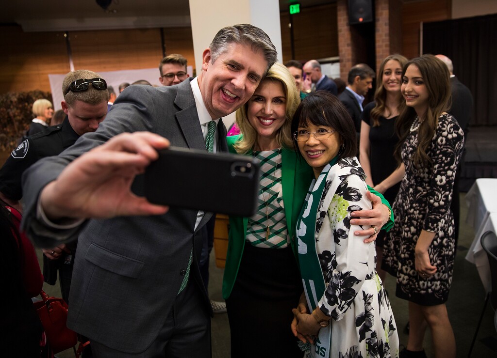 (August Miller  |  Utah Valley University)  Current UVU President Matthew S. Holland, left and his wife Paige get a selfie with Astrid Tuminez after she was announced as the first women president of Utah Valley University and as Holland's replacement at a press conference on the campus of Utah Valley University Friday April 20, 2018.