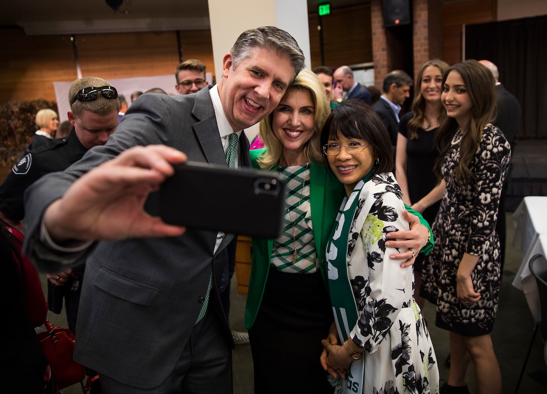 (August Miller  |  Utah Valley University)  Current UVU President Matthew S. Holland, left and his wife Paige get a selfie with Astrid Tuminez after she was announced as the first women president of Utah Valley University and as Holland's replacement at a press conference on the campus of Utah Valley University Friday April 20, 2018.