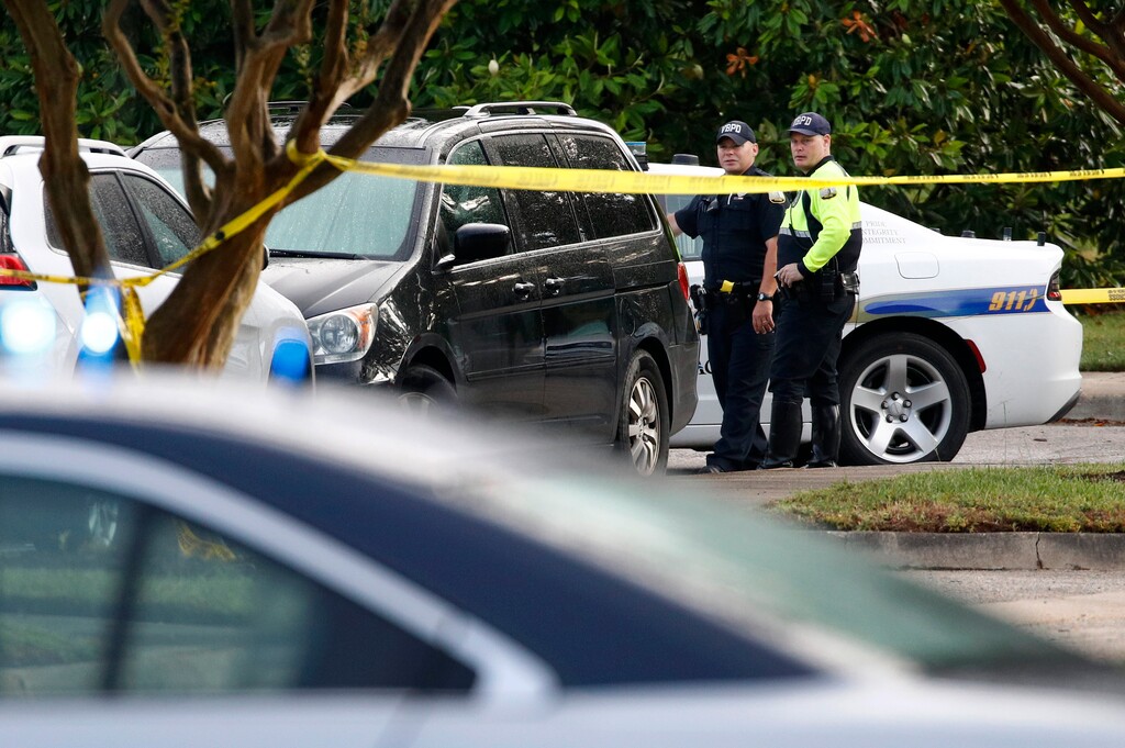 (Patrick Semansky | AP Photo)Law enforcement officials work outside a municipal building that was the scene of a shooting, Saturday, June 1, 2019, in Virginia Beach, Va. A longtime city employee opened fire at the building Friday before police shot and killed him, authorities said.