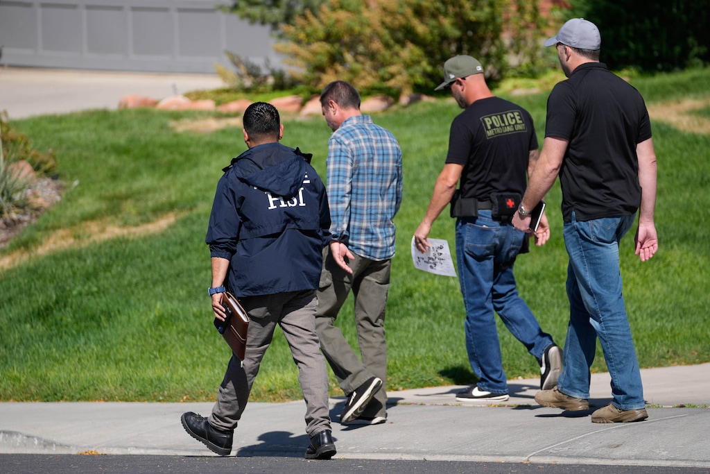 (Francisco Kjolseth  | The Salt Lake Tribune) Law enforcement comb the neighborhood near Utah Valley University in search for evidence the day after the shooting of Charlie Kirk at the school, Thursday, Sept. 11, 2025. 