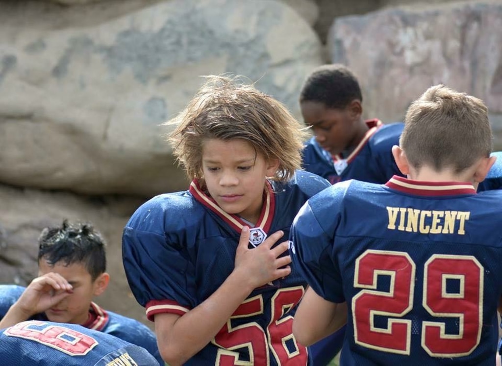 (Courtesy Celestia Ballard Muai) Tua Muai, 12, stands in a huddle with his teammates. Tua, who loved football, died May 11, 2018, while playing the "fainting game."