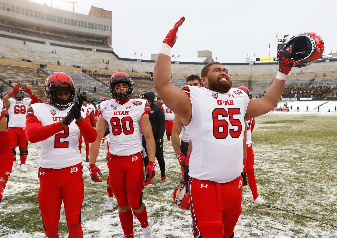 Utah offensive lineman Paul Toala (65) and teammates celebrate after an NCAA college football game against Colorado, Saturday, Nov. 17, 2018, in Boulder, Colo. Utah won 30-7. (AP Photo/David Zalubowski)