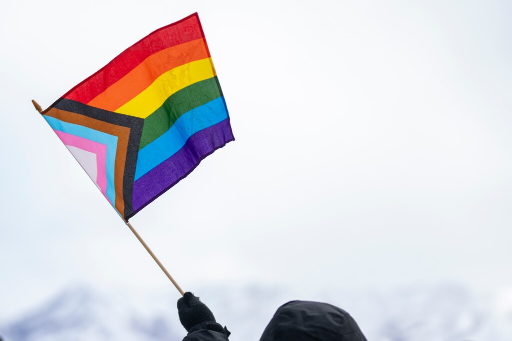 (Rick Egan | The Salt Lake Tribune) A person waves a pride flag at the Capitol in Salt Lake City for a protest in response to Trump administration policies on Friday, March 14, 2025.