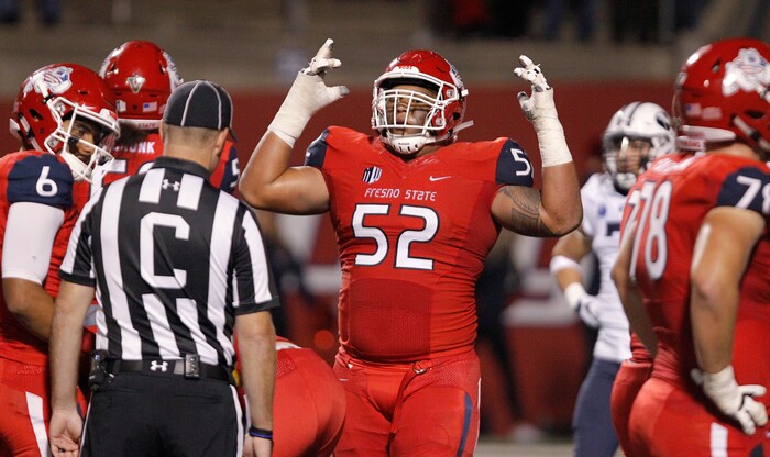 Fresno State's Netane Muti celebrates a victory against BYU during the second quarter of an NCAA college football game in Fresno, Calif., Saturday, Nov. 4, 2017. Fresno State won the game 20-13. (AP Photo/Gary Kazanjian)