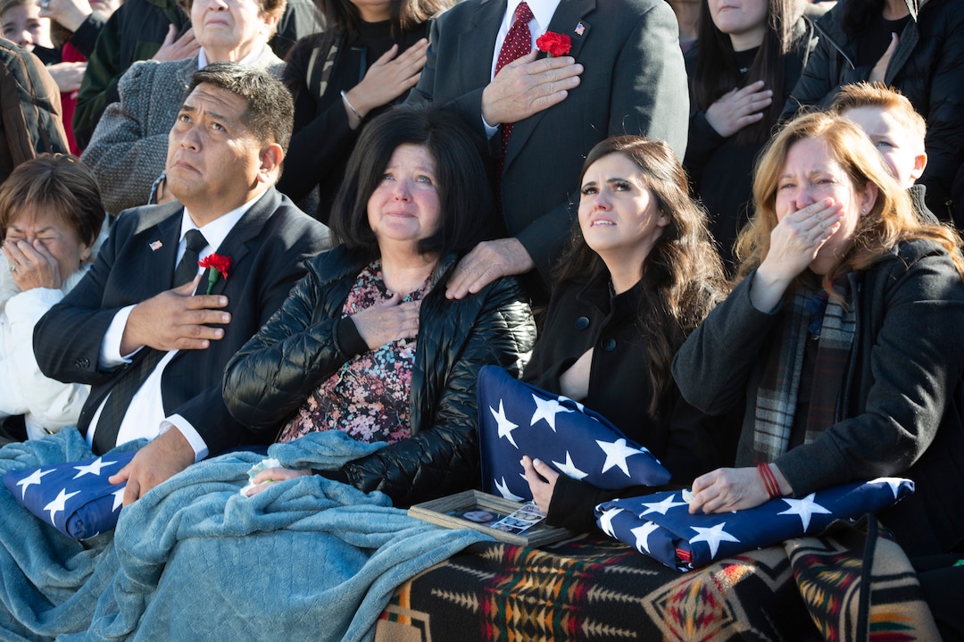 (Rick Egan  |  The Salt Lake Tribune) Family members of Army Chief Warrant Officer 2 Kirk T. Fuchigami Jr. watch as Apache helicopters fly over the Brigham City Cemetery, Monday, Dec. 9, 2019, during the graveside service for Fuchigami, who was killed in Afghanistan last month.