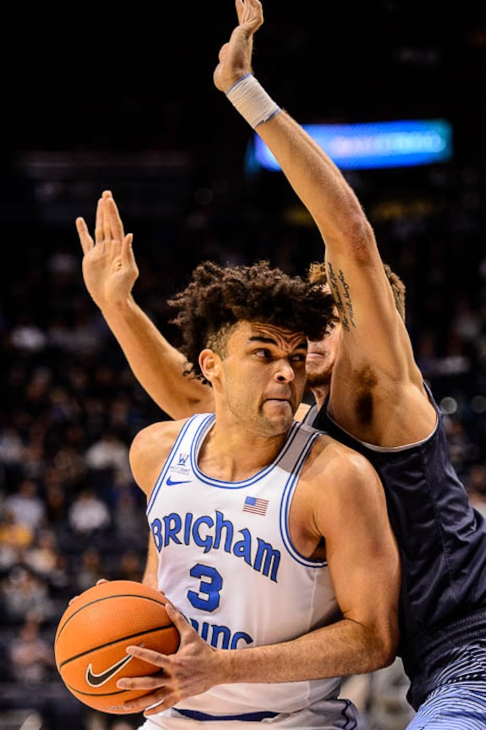 (Trent Nelson | The Salt Lake Tribune)   Brigham Young Cougars guard Elijah Bryant (3) defended by San Diego Toreros forward Isaiah Pineiro (0) as BYU hosts San Diego, NCAA basketball in Provo Saturday January 20, 2018.