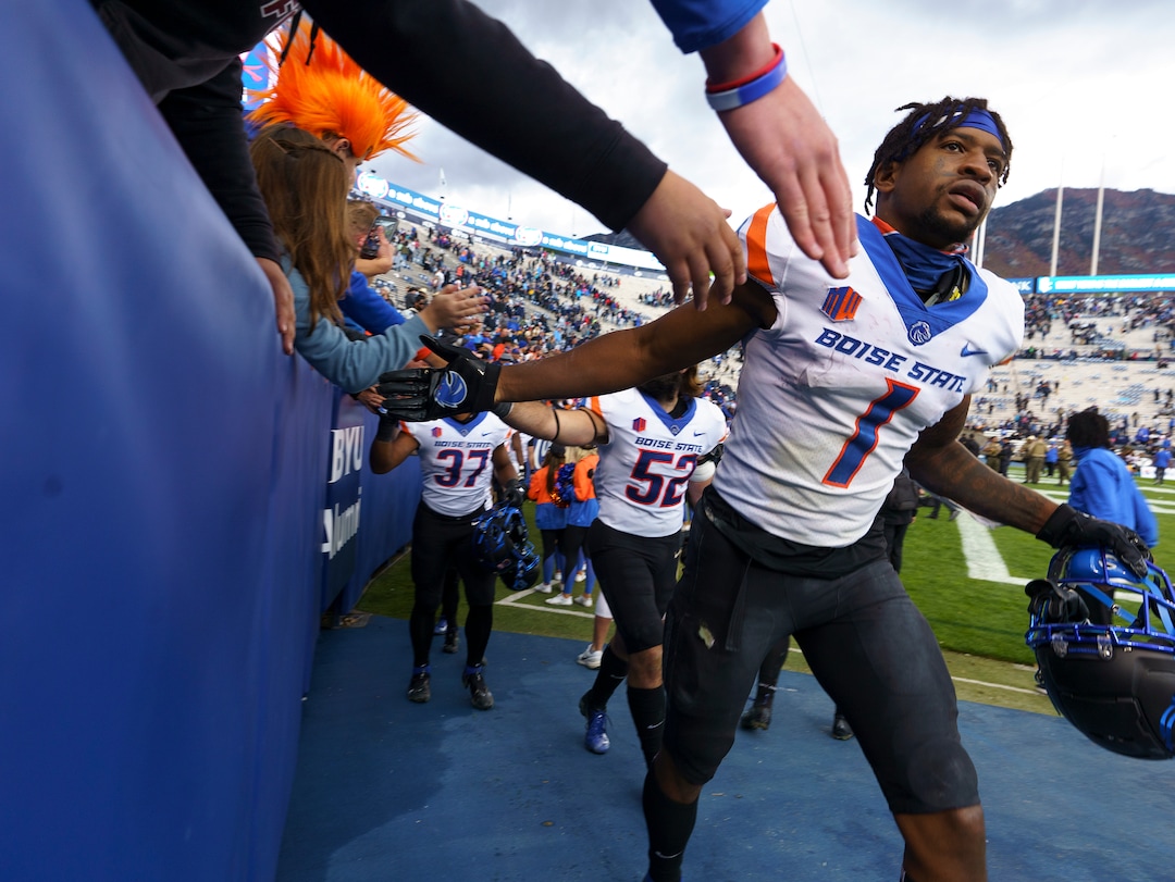 (Leah Hogsten | The Salt Lake Tribune) Boise State Broncos wide receiver Octavius Evans (1) celebrates the win with fans as No. 10 Brigham Young University hosts Boise State at LaVell Edwards Stadium, Oct. 9, 2021.