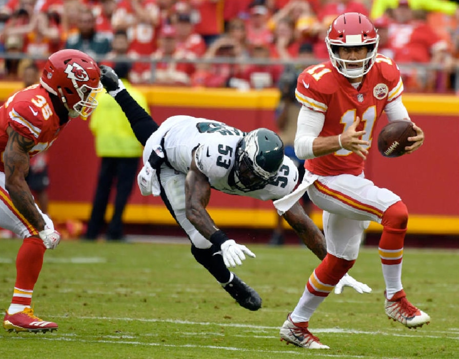 Ed Zurga | The Associated Press. Kansas City Chiefs quarterback Alex Smith (11) runs away from Philadelphia Eagles linebacker Nigel Bradham (53) during the first half of an NFL football game in Kansas City, Mo., Sunday, Sept. 17, 2017.