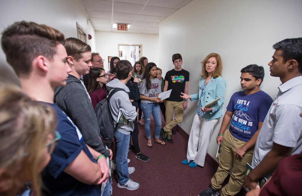 Florida Rep. Kristin Jacobs talks with student survivors from Marjory Stoneman Douglas High School in the hallway at the Florida Capitol in Tallahassee, Fla., Feb 21, 2018. The students from Marjory Stoneman Douglas High School are in town to lobby the Florida Legislature after a shooting that left 17 dead at their school. (AP Photo/Mark Wallheiser)
