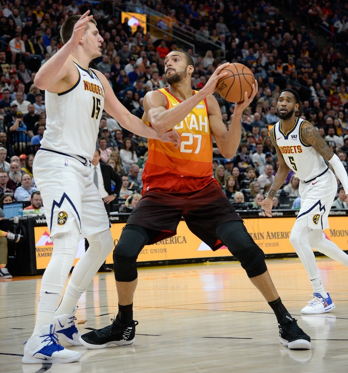 (Francisco Kjolseth  |  The Salt Lake Tribune)  Utah Jazz center Rudy Gobert (27) looks to get past Denver Nuggets center Nikola Jokic (15) as the Utah Jazz host the Denver Nuggets in their NBA game at Vivint Smart Home Arena Tuesday, April 9, 2019, in Salt Lake City.